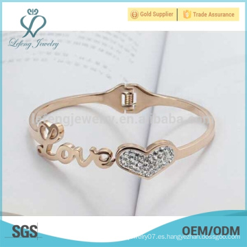 Pulsera cristalina del brazalete del corazón del oro 18K del titanio, brazalete del nudo del amor